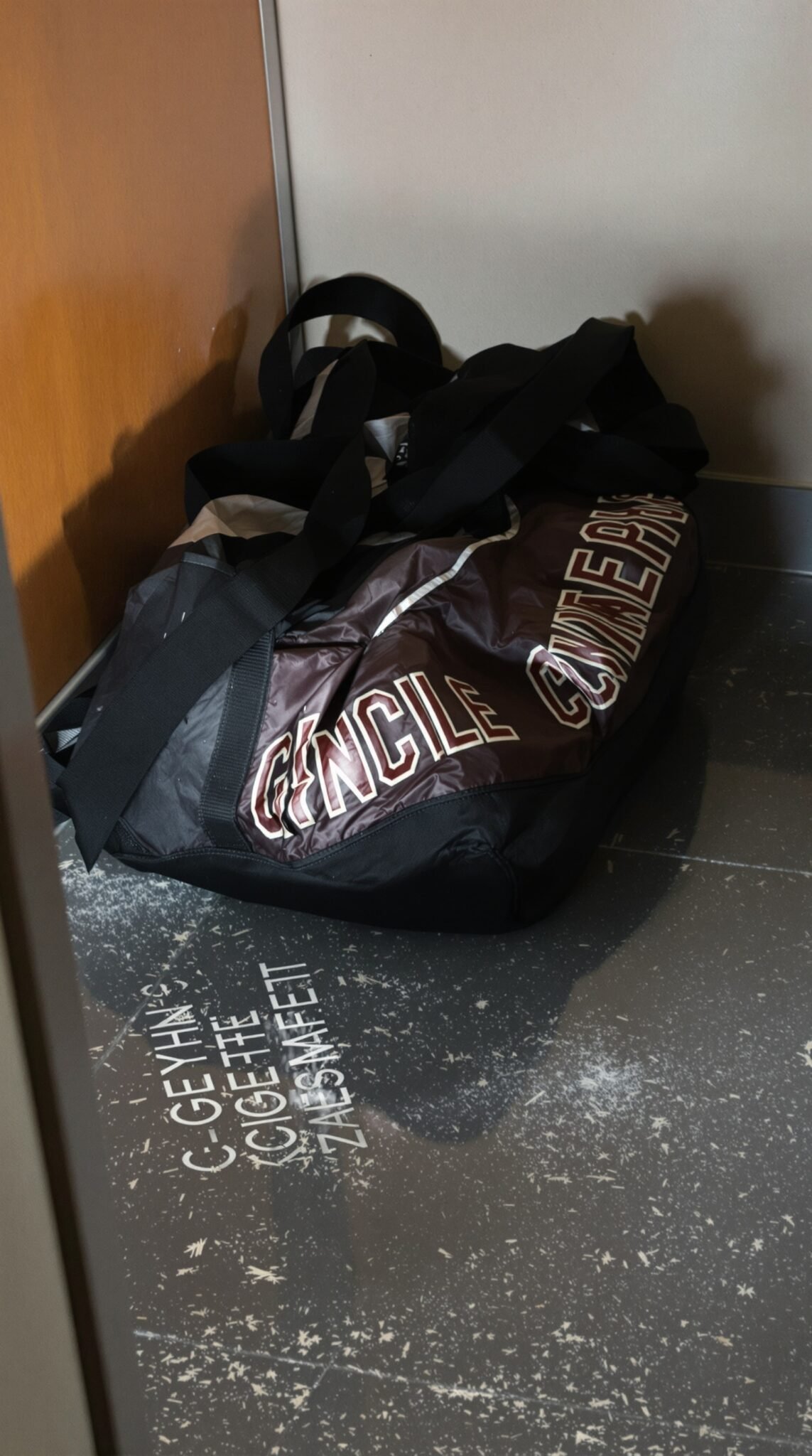 An unattended gym bag sitting in a corner, symbolizing skipped workouts and missed fitness goals.